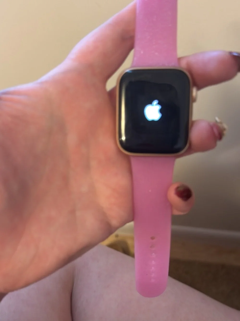 Apple Smartwatch with Pink Silicone Band and Black Display